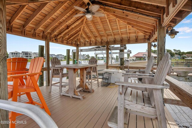 wooden terrace featuring a ceiling fan