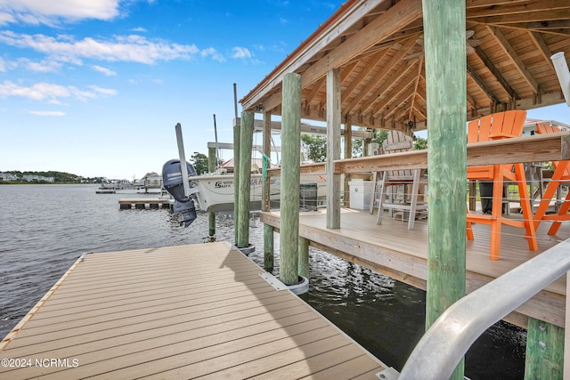 dock area with a water view