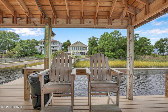 wooden deck featuring ceiling fan