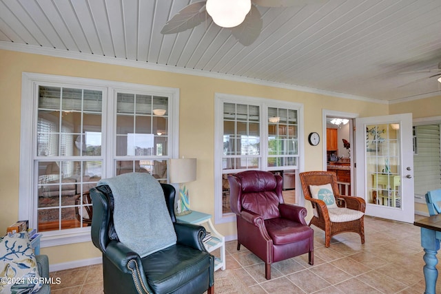 interior space with ceiling fan, a healthy amount of sunlight, and wooden ceiling