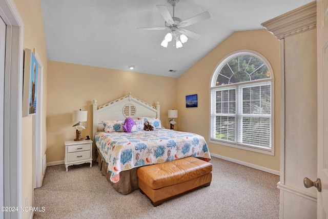 bedroom featuring carpet floors, multiple windows, and vaulted ceiling