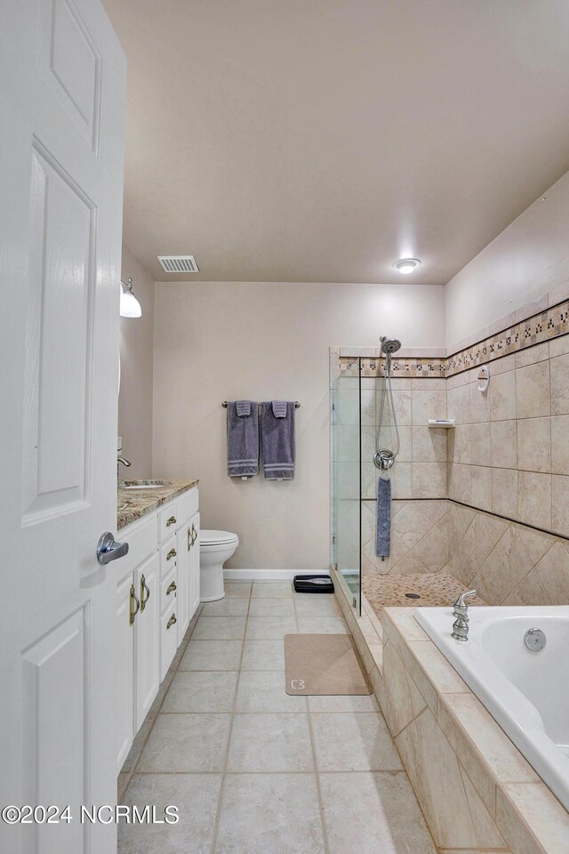 full bathroom featuring plus walk in shower, tile patterned floors, toilet, and vanity