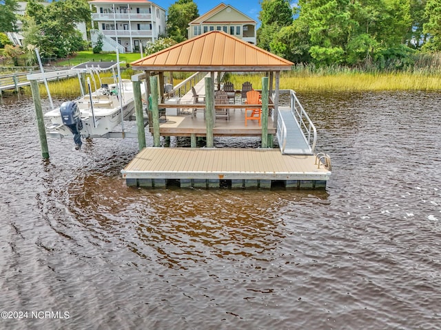 dock area featuring a water view and boat lift