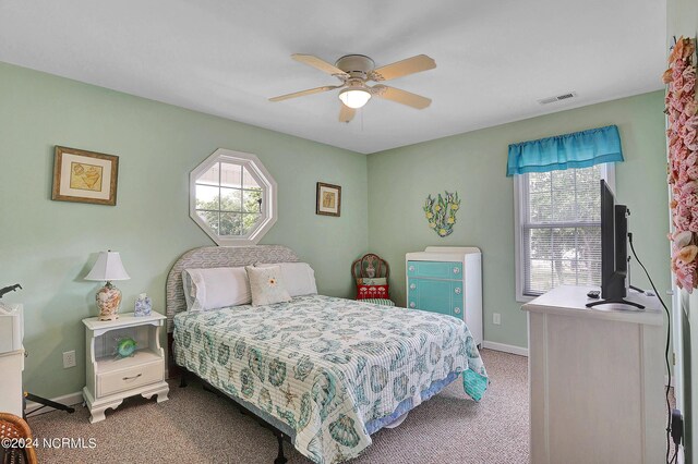 carpeted bedroom with ceiling fan