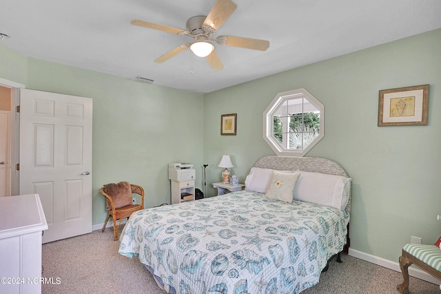 bedroom with ceiling fan and light carpet