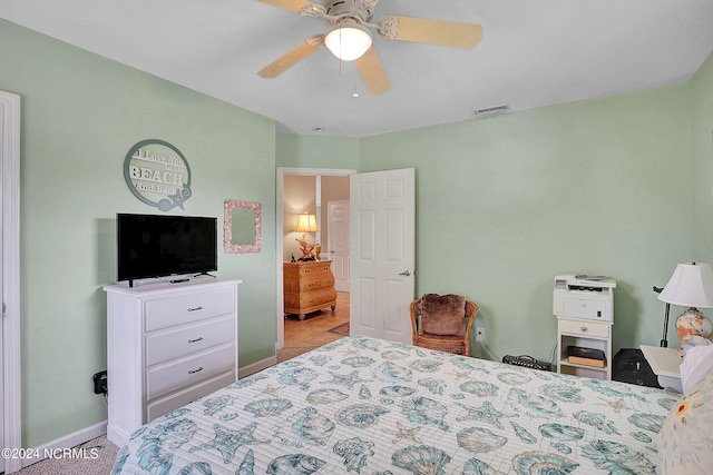 tiled bedroom with ceiling fan