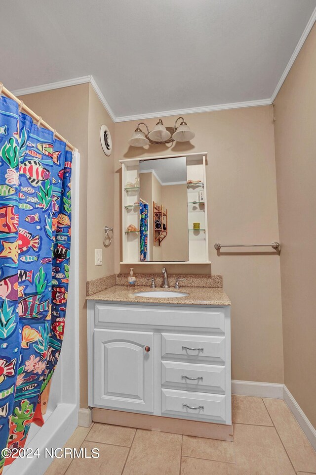 bathroom featuring tile patterned flooring, crown molding, a shower with shower curtain, and vanity