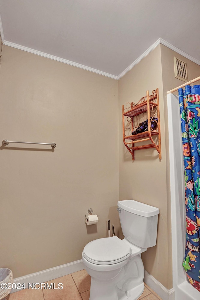 bathroom featuring crown molding, visible vents, toilet, tile patterned flooring, and baseboards