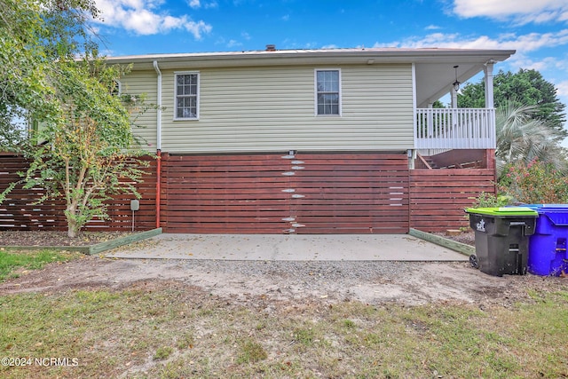 view of side of property with a patio area