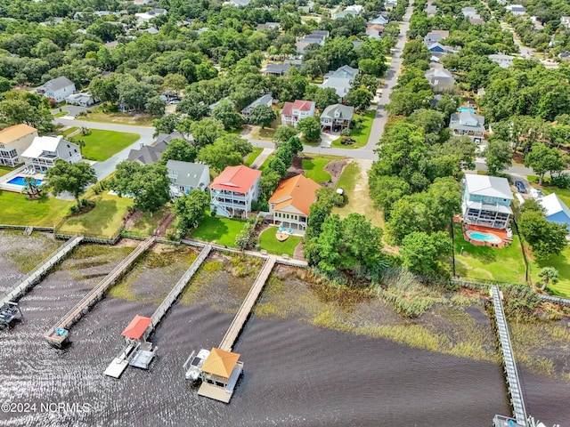 birds eye view of property featuring a water view and a residential view