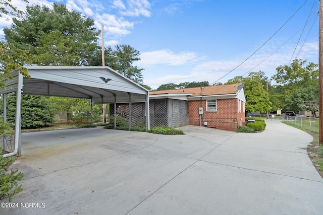 exterior space with a carport