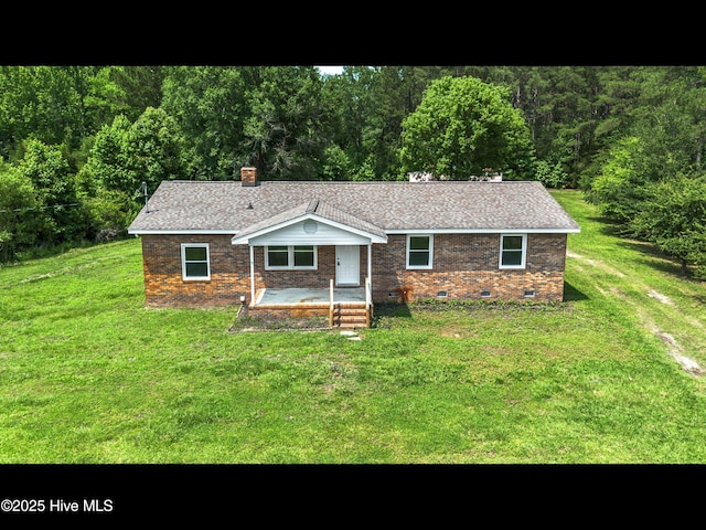 9348 NC Highway 210, Rocky Point, NC 28457 - ranch-style house featuring crawl space, brick siding, a front lawn, and a chimney