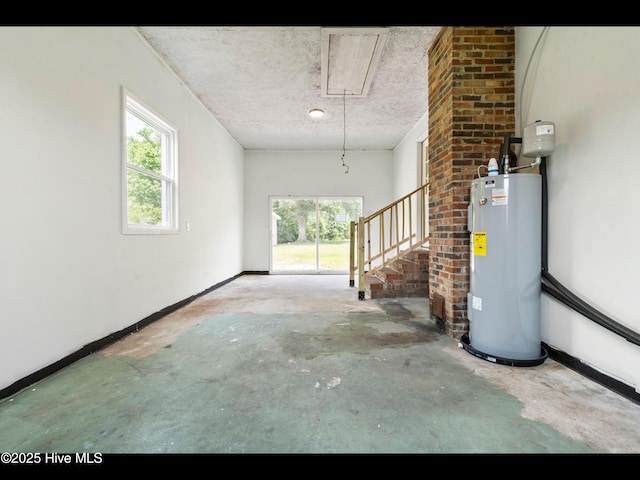 9348 NC Highway 210, Rocky Point, NC 28457 - basement featuring water heater, a textured ceiling, and stairway