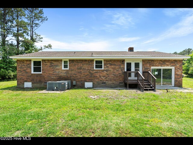 9348 NC Highway 210, Rocky Point, NC 28457 - back of property with crawl space, central AC, french doors, and brick siding