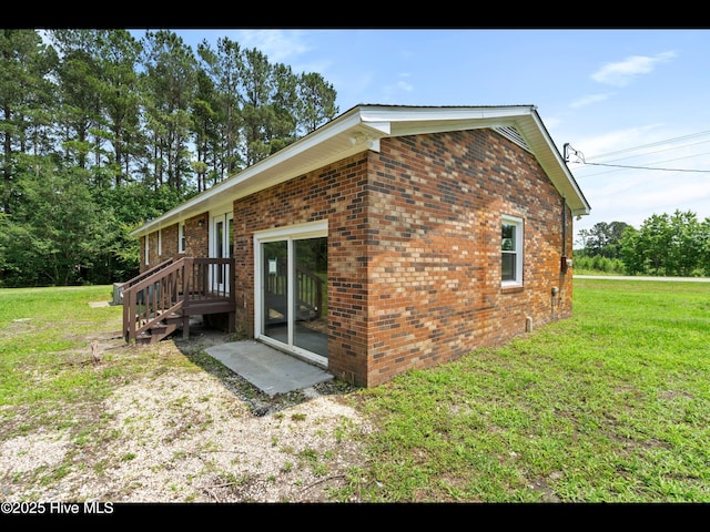9348 NC Highway 210, Rocky Point, NC 28457 - view of home's exterior with a lawn and brick siding