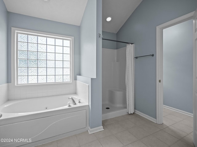 bathroom with a textured ceiling, shower with separate bathtub, lofted ceiling, and tile patterned floors