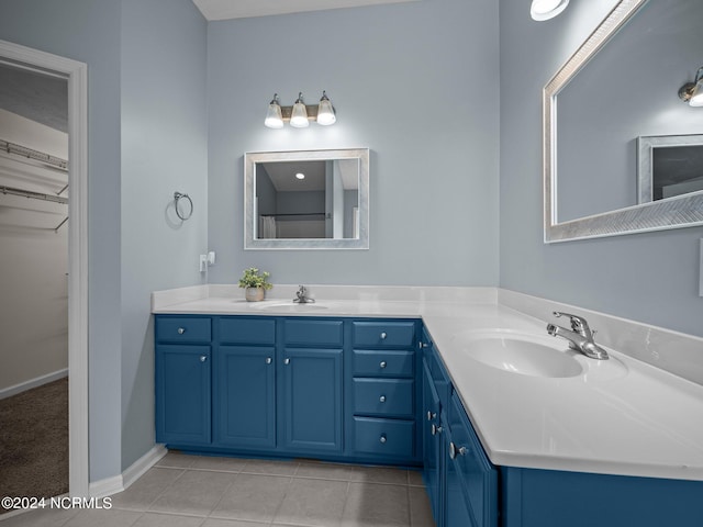 bathroom with tile patterned floors and vanity