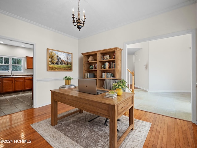 office area with an inviting chandelier, hardwood / wood-style flooring, and crown molding