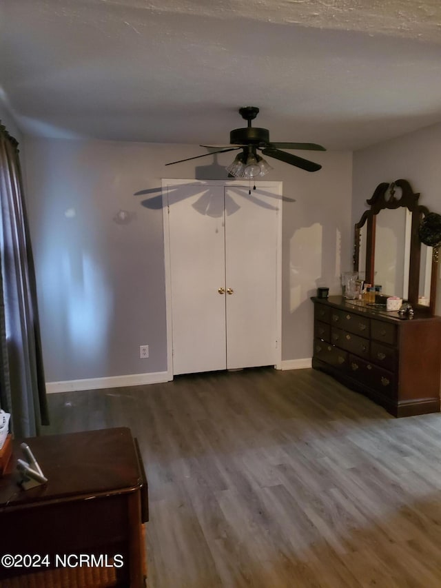 unfurnished bedroom with hardwood / wood-style flooring and ceiling fan