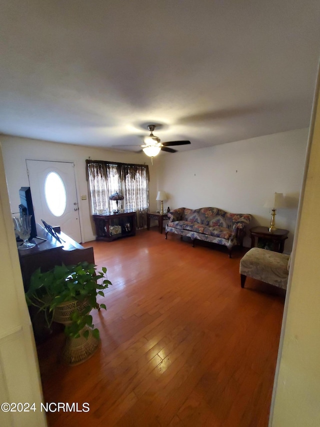 interior space with ceiling fan and hardwood / wood-style flooring