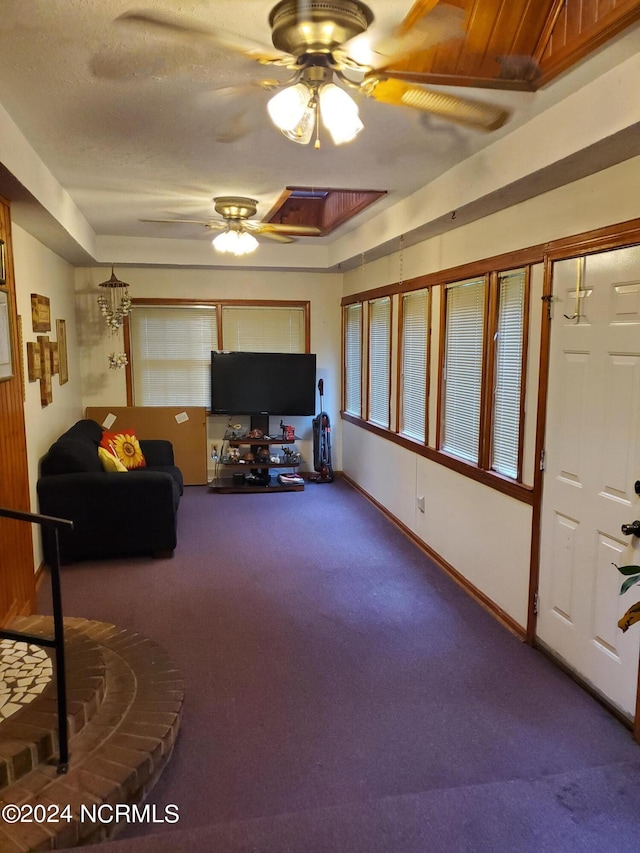 living room with carpet floors and ceiling fan