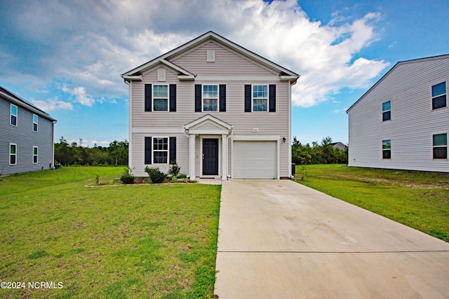 view of front of house featuring a front lawn and a garage