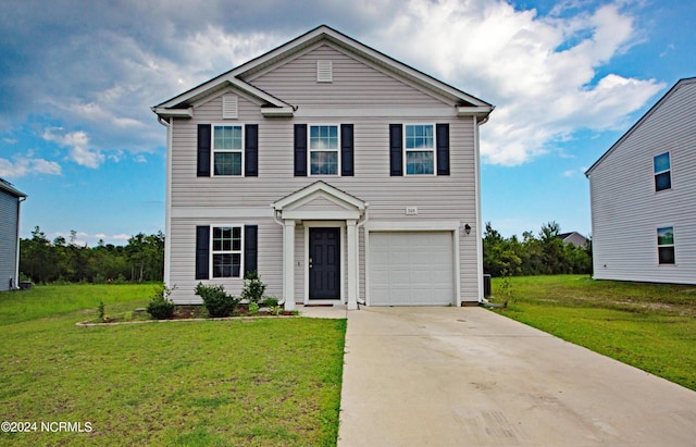 view of front of home featuring a garage and a front lawn