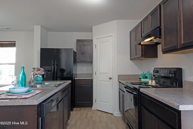 kitchen featuring sink, black appliances, dark brown cabinets, exhaust hood, and light wood-type flooring