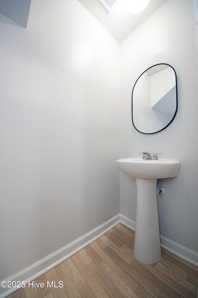 bathroom featuring wood-type flooring