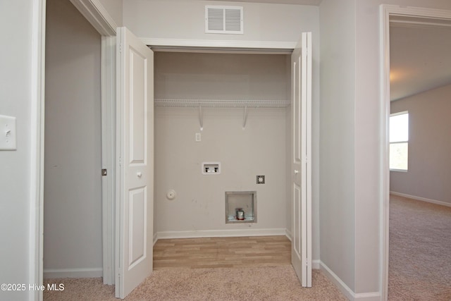 laundry area featuring washer hookup, gas dryer hookup, and light colored carpet