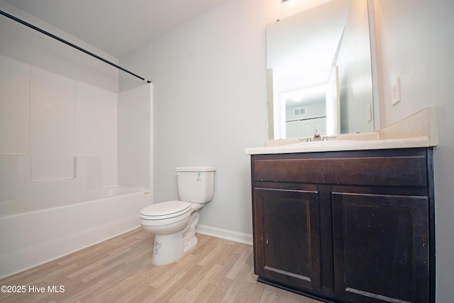 full bathroom featuring toilet, vanity, wood-type flooring, and tub / shower combination