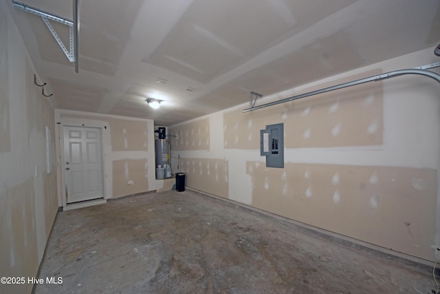 garage featuring gas water heater and electric panel