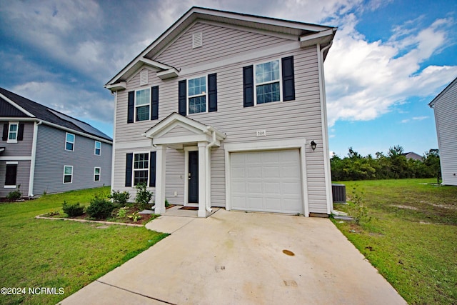 view of front of property featuring a front yard and a garage