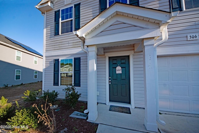 property entrance featuring a garage