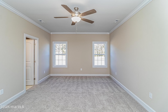 unfurnished room featuring ceiling fan, crown molding, and light colored carpet