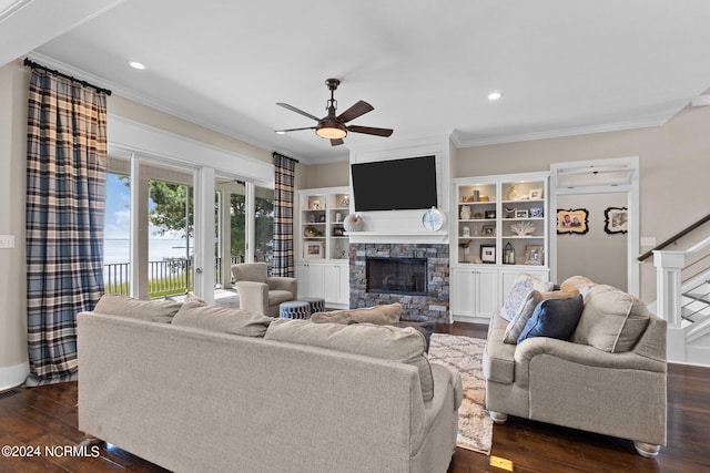 living room with ceiling fan, a fireplace, dark hardwood / wood-style floors, and crown molding