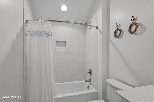 bathroom with shower / bath combination with curtain and toilet