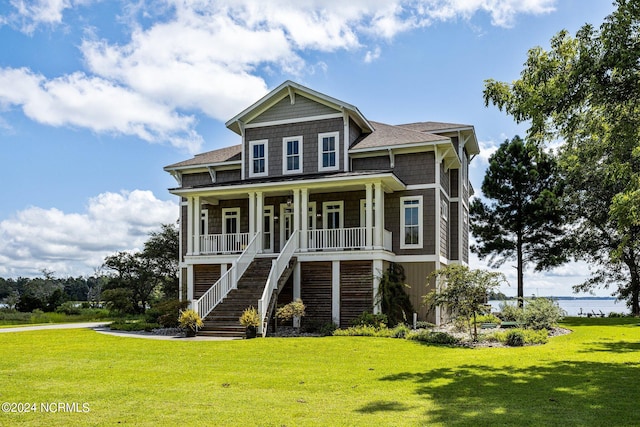 view of front of home featuring a porch and a front lawn