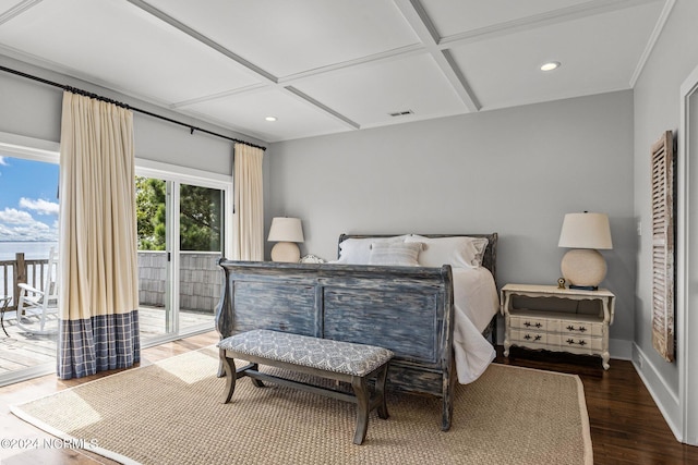 bedroom featuring dark wood-type flooring, coffered ceiling, and access to outside