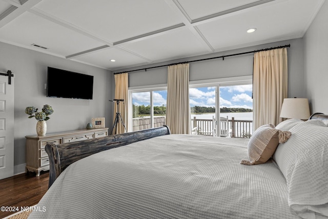 bedroom featuring dark wood-style floors, access to outside, coffered ceiling, and a barn door