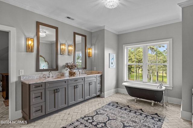 bathroom with a tub to relax in, vanity, and crown molding