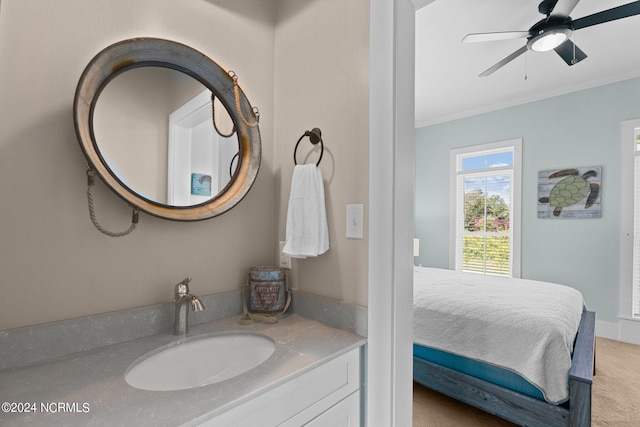 bathroom featuring ornamental molding, connected bathroom, vanity, and a ceiling fan