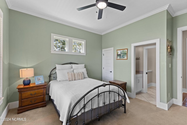 bedroom with crown molding, ceiling fan, light carpet, and connected bathroom