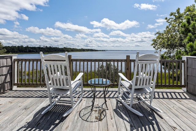 deck featuring a water view