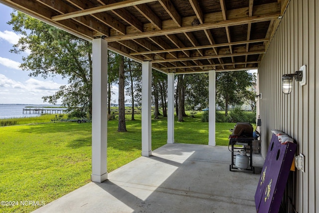 view of patio with a water view