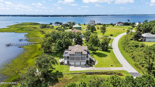 birds eye view of property with a water view