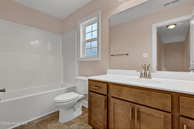 full bathroom featuring tile patterned flooring, vanity, toilet, and shower / bathing tub combination