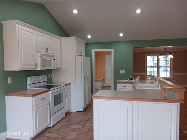 kitchen with lofted ceiling, white appliances, white cabinetry, and sink