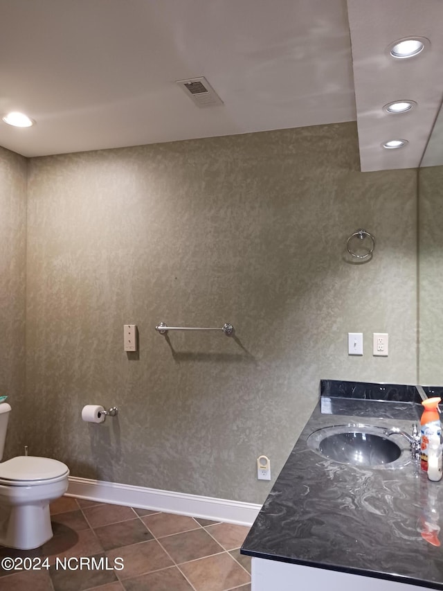 bathroom with tile patterned floors, toilet, and vanity