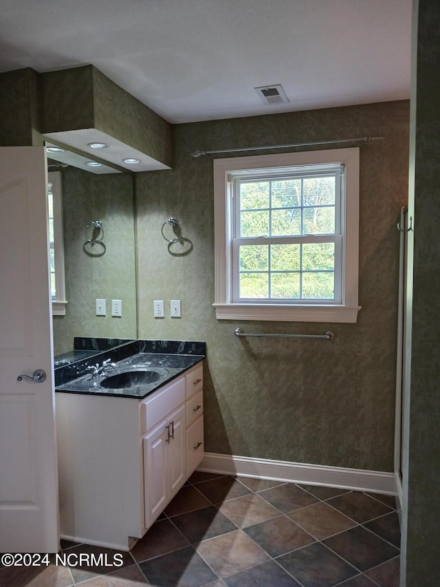 bathroom featuring tile patterned floors and vanity